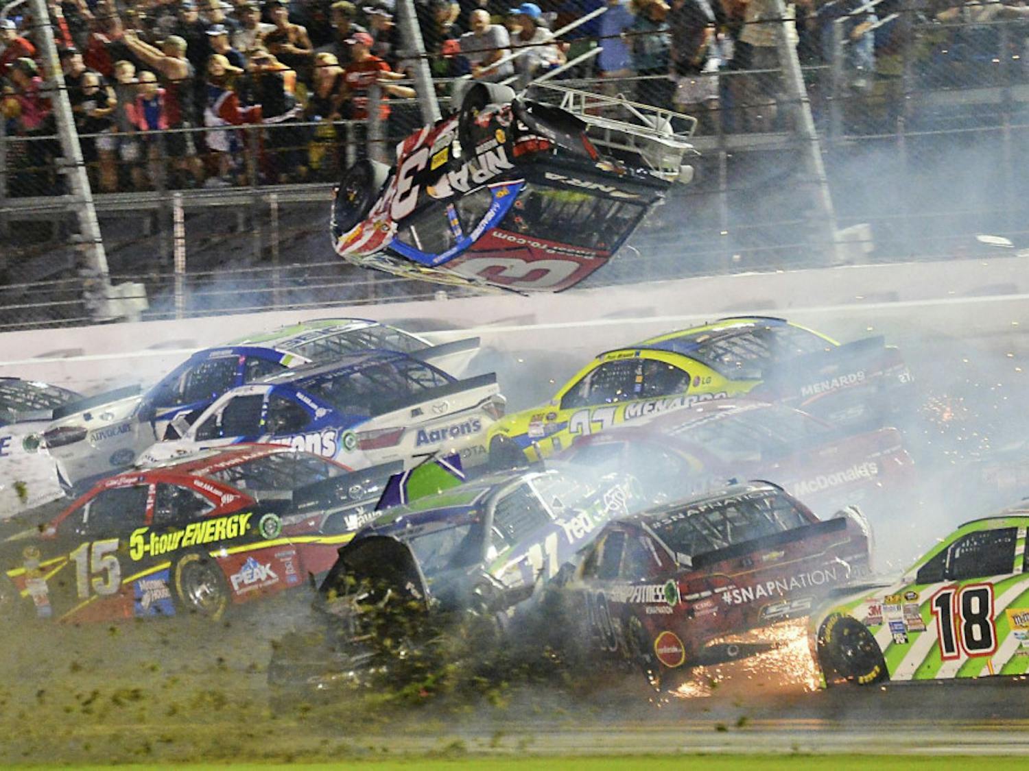 Austin Dillon (3) goes airborne as he was involved in a multi-car crash on the final lap of the NASCAR Sprint Cup series auto race at Daytona International Speedway in Daytona Beach, Florida.