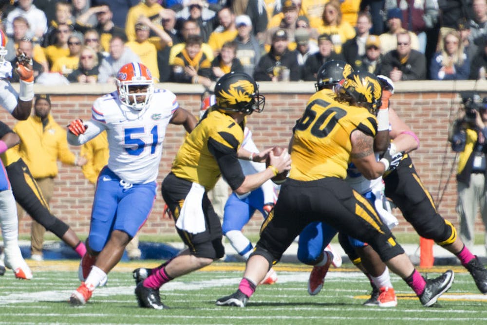 <p class="p1">Mike Taylor (51) pursues Missouri quarterback Maty Mauk during the Gators' 36-17 loss to the Tigers on Oct. 19 in Columbia, Mo.</p>