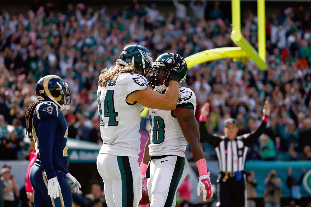 Philadelphia Eagles' Jeremy Maclin, right, and Riley Cooper celebrate after Maclin's touchdown during the second half of an NFL football game against the St. Louis Rams, Sunday, Oct. 5, 2014, in Philadelphia.