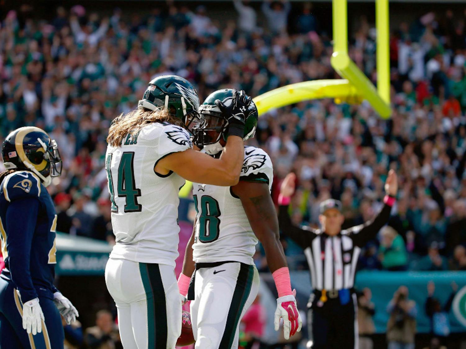 Philadelphia Eagles' Jeremy Maclin, right, and Riley Cooper celebrate after Maclin's touchdown during the second half of an NFL football game against the St. Louis Rams, Sunday, Oct. 5, 2014, in Philadelphia.