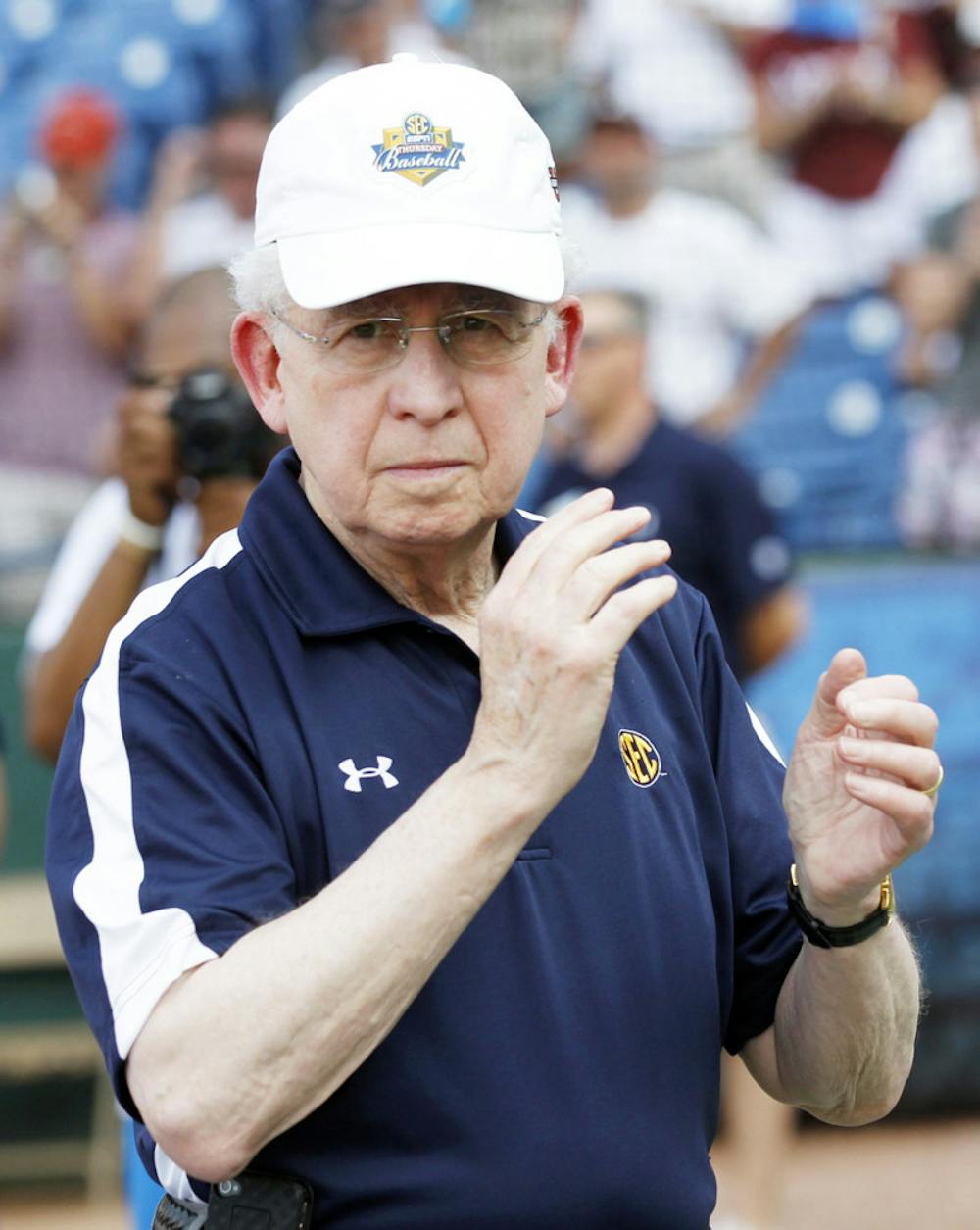<p>Southeastern Conference commissioner Mike Slive applauds at the SEC Tournament on May 27. Slive contributed to the development of college football’s new four-team playoff format.</p>