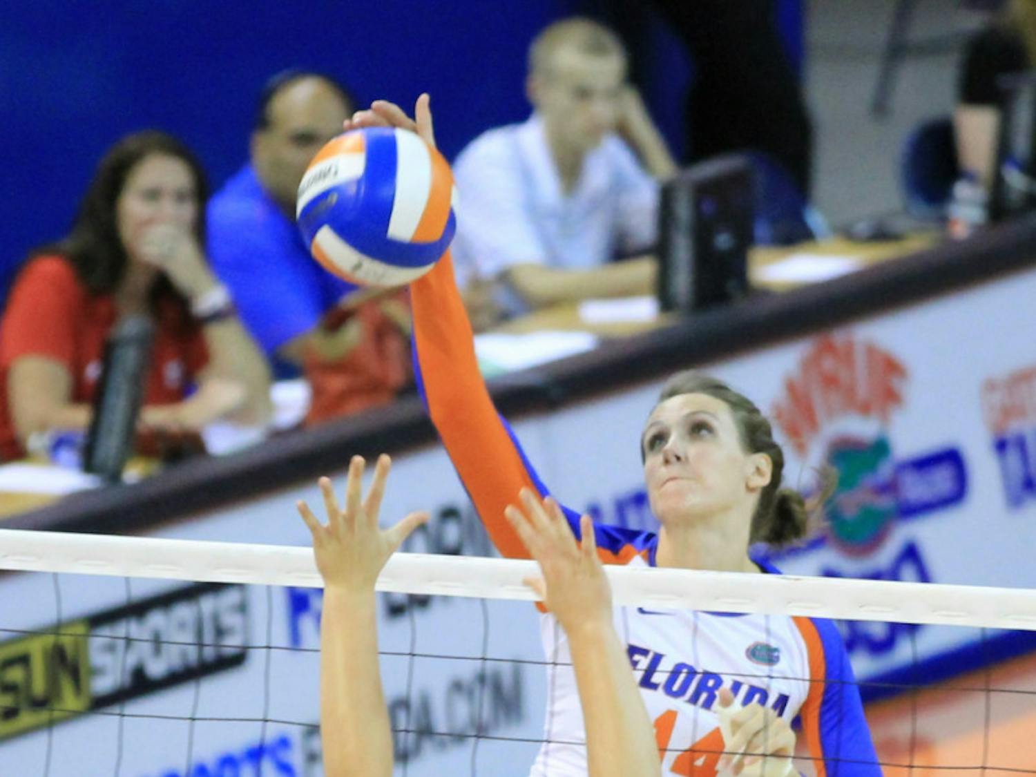 Middle blocker Betsy Smith (14) attempts an attack against Jacksonville in Florida’s 3-0 victory on Sept. 7 in the O’Connell Center. Smith is the last player from the top-ranked 2008 recruiting class still suiting up for the Gators.