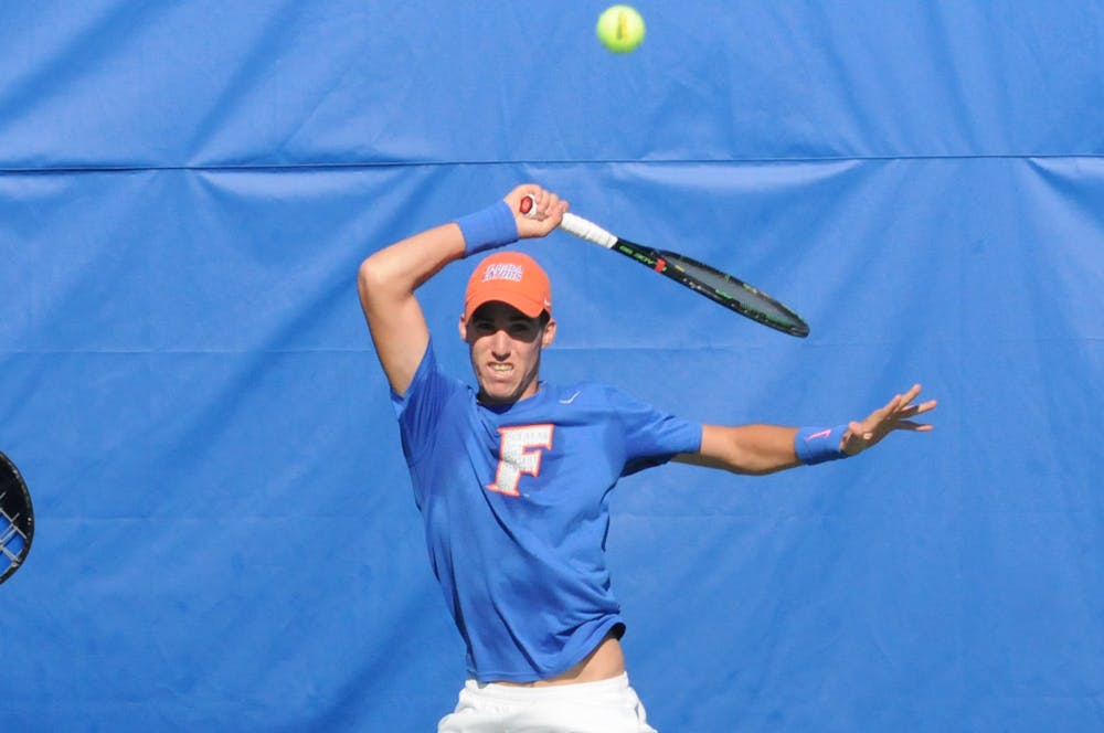 <p>Alfredo Perez returns a pass during Florida's 6-1 win over Troy on Jan. 17, 2016, at the Ring Tennis Complex.</p>