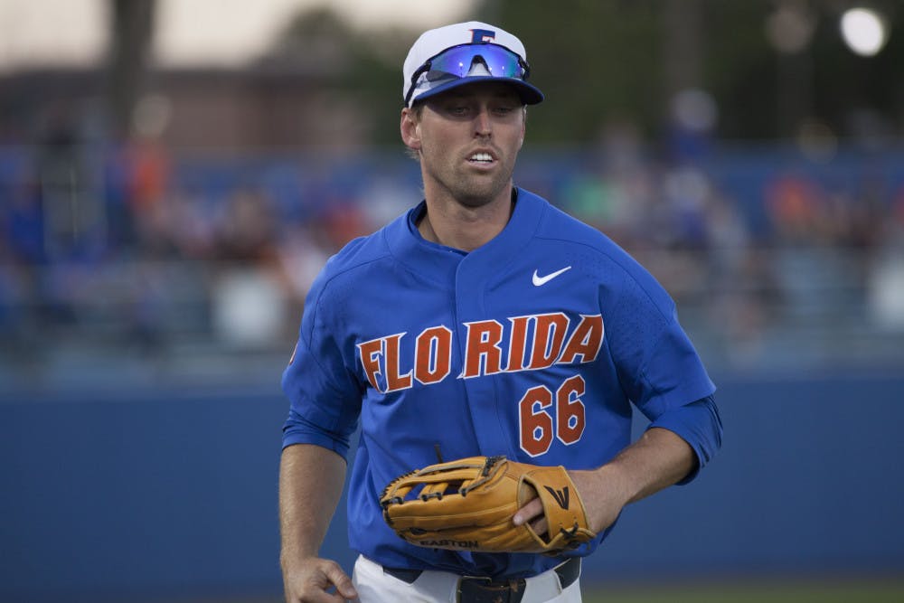<p>UF outfielder Ryan Larson jogs to the dugout during Florida's 3-2 loss against Tennessee on April 8, 2017, at McKethan Stadium.</p>