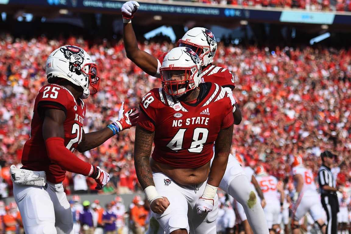 Then-NC State defensive lineman Cory Durden celebrates with teammates after a sack in Carter-Finley Stadium on Saturday, Sept. 25, 2021. Photo courtesy of Natalie Folsom, Agromeck Photo Editor.