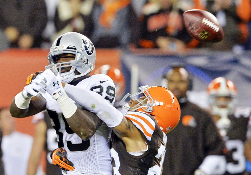 Cleveland Browns cornerback Joe Haden, right, breaks up a pass for Oakland Raiders wide receiver James Jones (89) in the fourth quarter of an NFL football game Sunday, Oct. 26, 2014, in Cleveland.