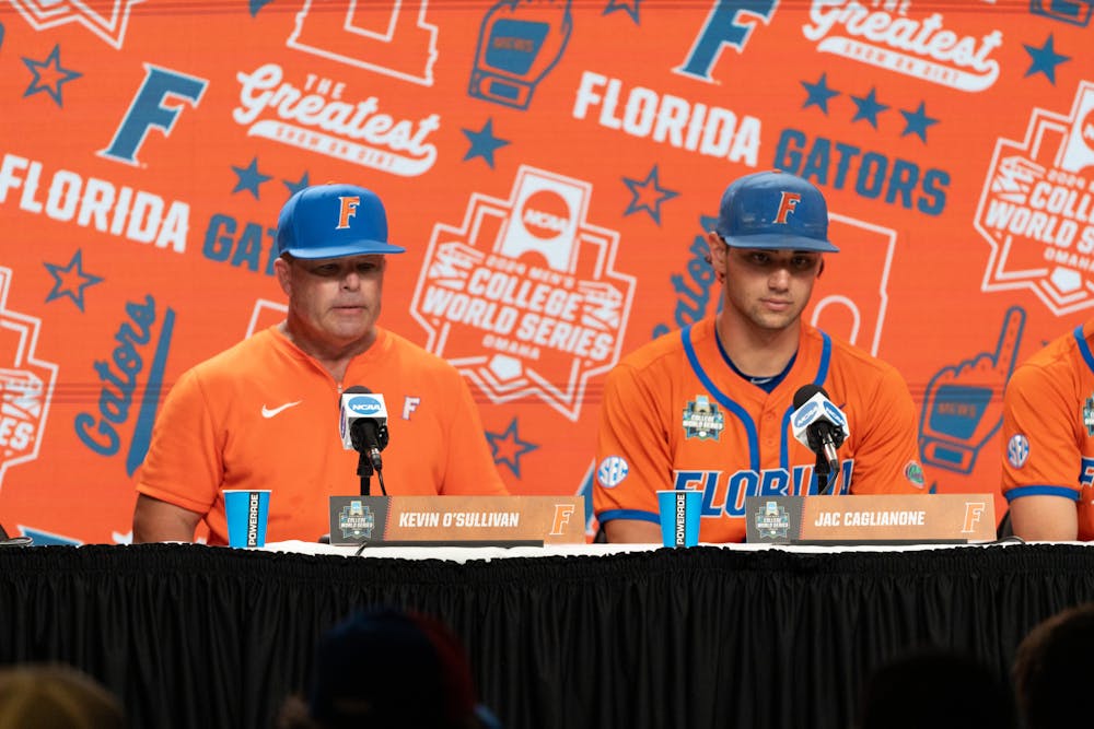 <p>Florida baseball head coach Kevin O&#x27;Sullivan sits with two-way star Jac Caglianone following the Gators’ 5-4 win against the North Carolina State Wolfpack at the College World Series in Omaha, Nebraska on Monday, June 17, 2024.</p>