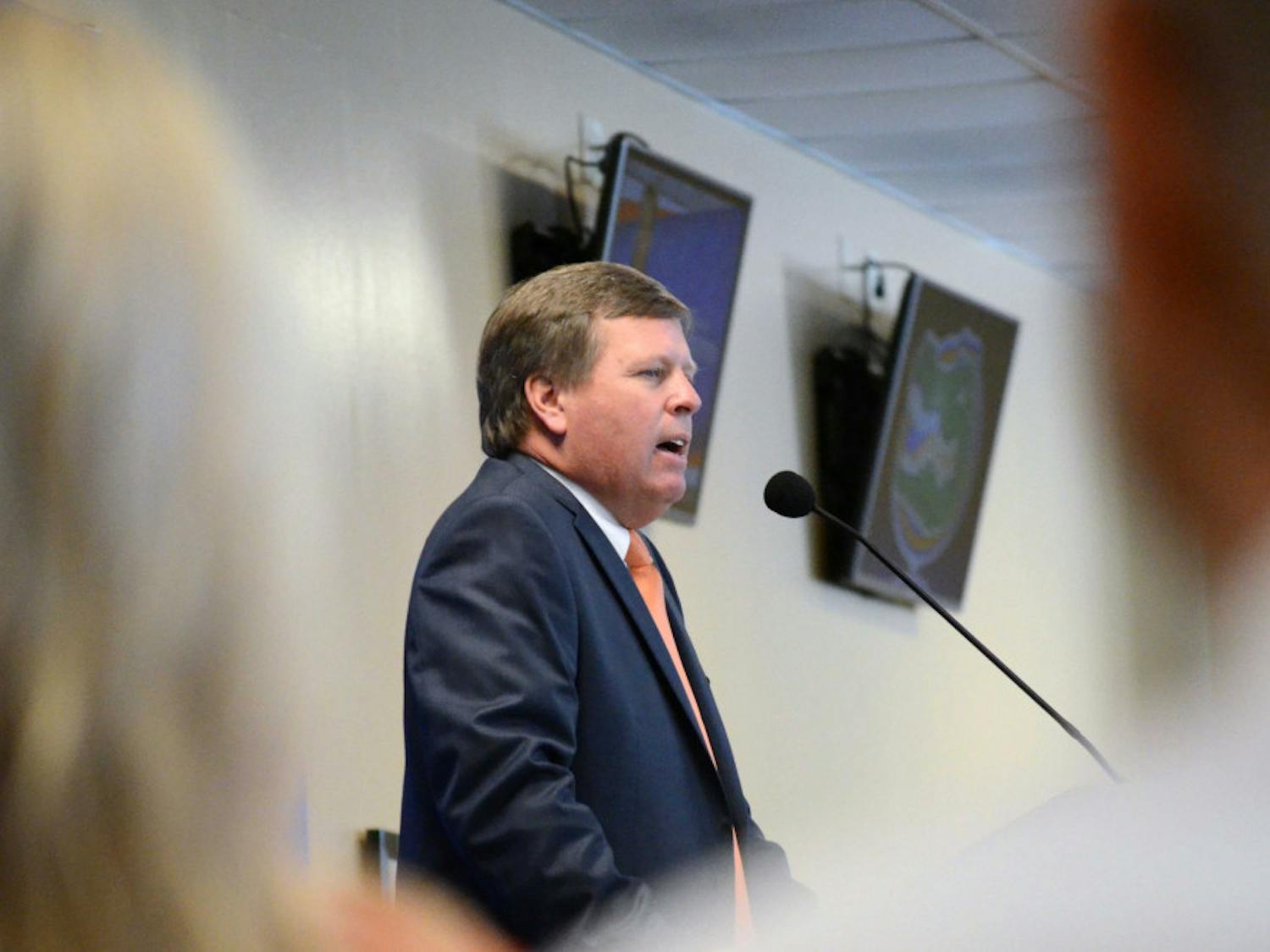 New head football coach Jim McElwain speaks at his opening press conference in Ben Hill Griffin Stadium.