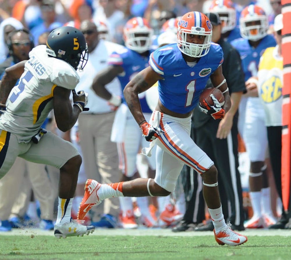 <p>Quinton Dunbar runs past an opposing player during Florida’s 24-6 victory against Toledo on Aug. 31 in Ben Hill Griffin Stadium. Dunbar caught two passes for 22 yards in the game.</p>