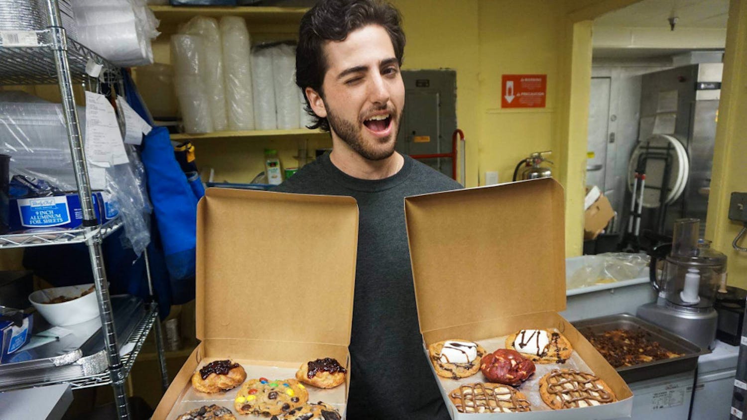 Daniel Leal, a 22-year-old UF sustainability studies senior and founder of cookie-delivery company Cookiegazm, poses with a batch of his cookies in October 2016. The late-night cookie delivery business announced it was closing on Facebook.