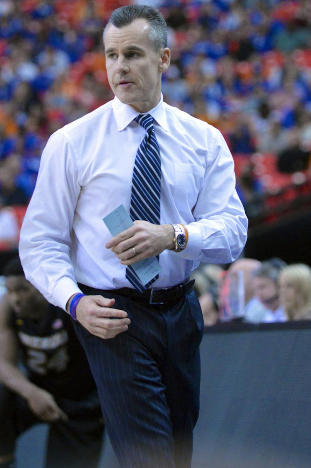 <p>Billy Donovan looks down the court during Florida's win against Missouri during the 2014 SEC Tournament in Atlanta.</p>