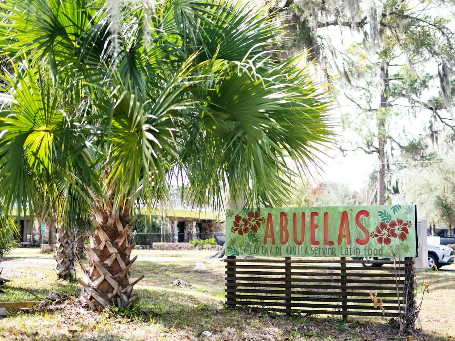 A sign for La Cocina de Abuela stands outside the restaurant in Gainesville, Fla., on Thursday, Feb. 13, 2025.