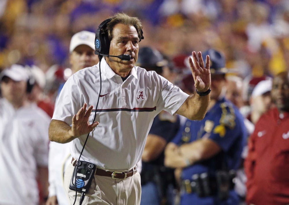 <p>Alabama head coach Nick Saban tries to get the referee's attention as the play clock approaches zero in the second half of an NCAA college football game against LSU in Baton Rouge, La., Saturday, Nov. 5, 2016. Alabama won 10-0. (AP Photo/Gerald Herbert)</p>