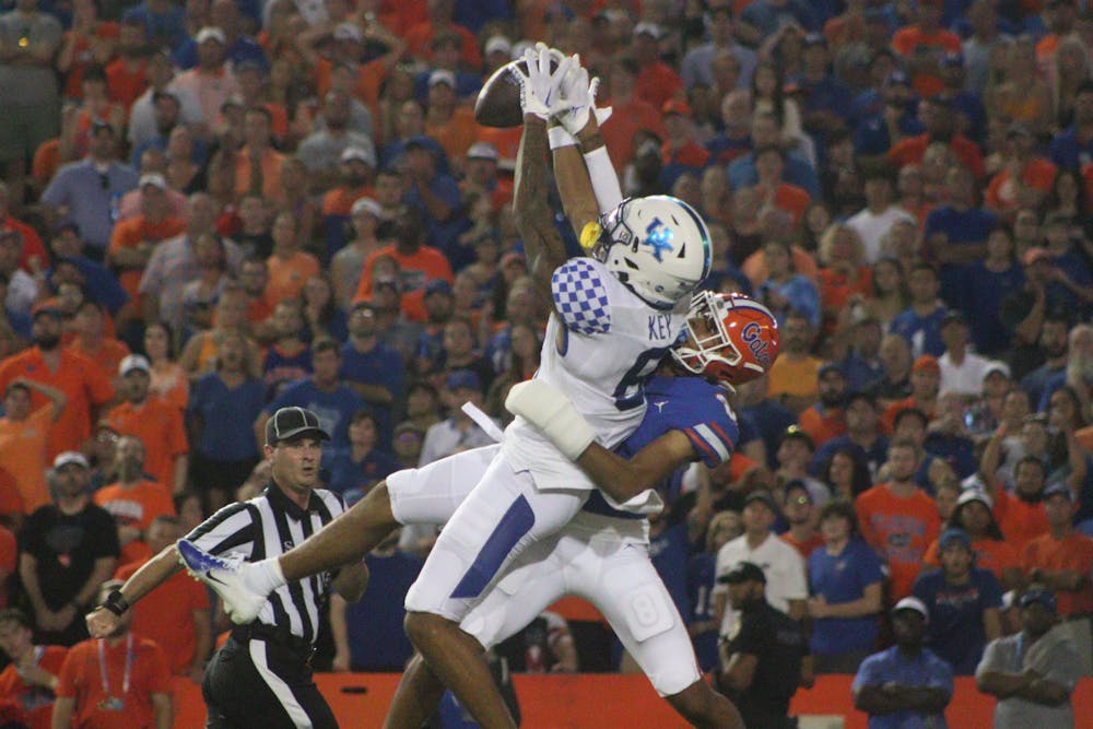 Kentucky wide receiver Dane Key catches a 55-yard touchdown pass over Florida defensive back Jalen Kimber during the Gators' 26-16 loss to the Wildcats Saturday, Sept. 10, 2022. 
