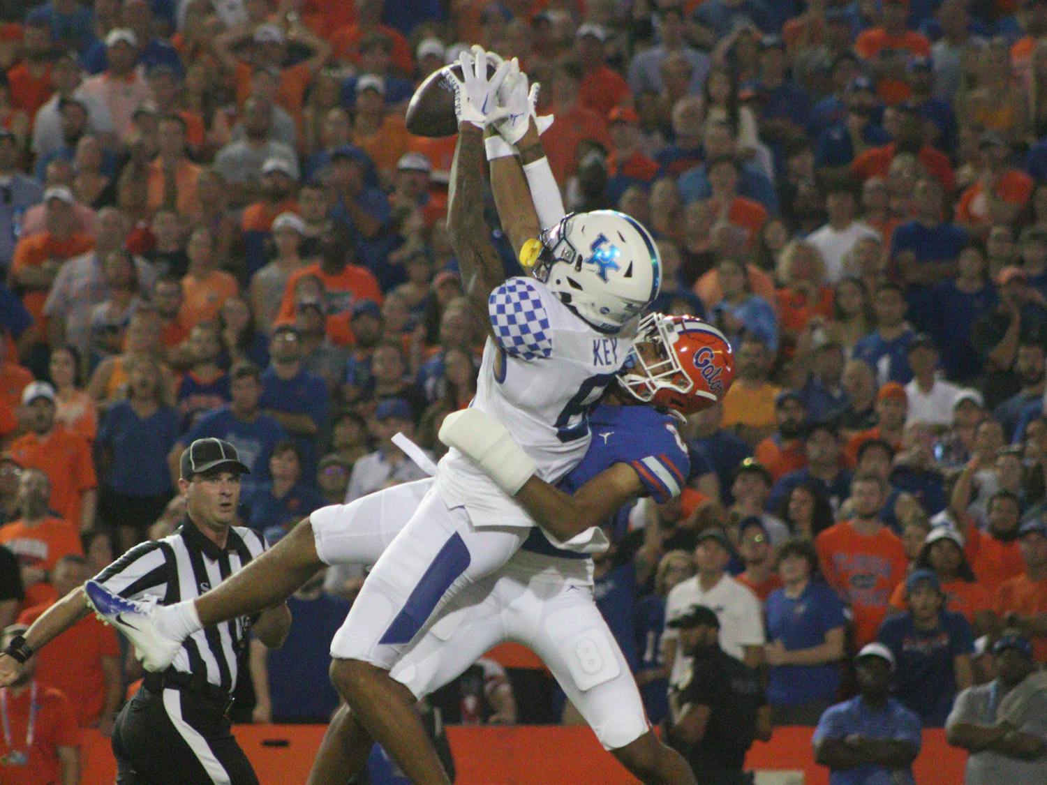Kentucky wide receiver Dane Key catches a 55-yard touchdown pass over Florida defensive back Jalen Kimber during the Gators' 26-16 loss to the Wildcats Saturday, Sept. 10, 2022. 
