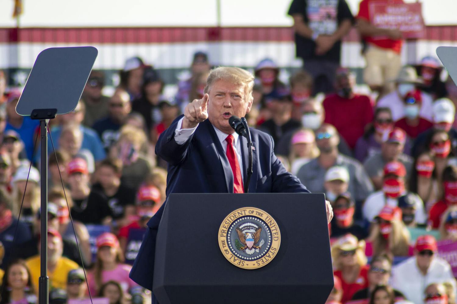President Donald Trump points his finger at the crowd during his campaign rally at the Ocala International Airport on Friday, Oct. 16, 2020.