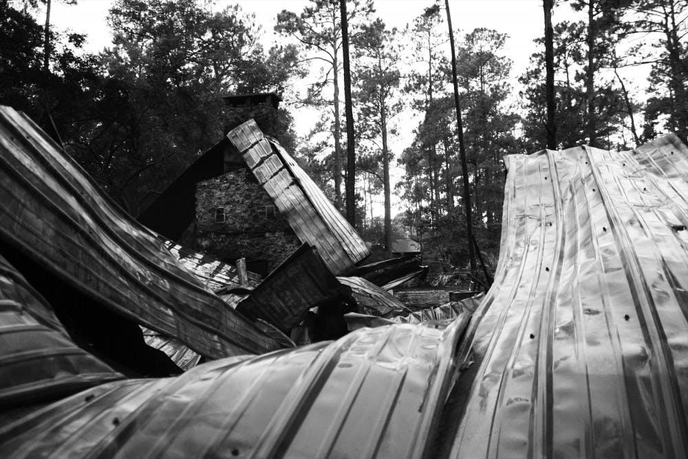 <p>A fire burned down a cypress log conference center on Tuesday in
UF's Austin Cary Memorial Forest, 16025 Waldo Road.</p>