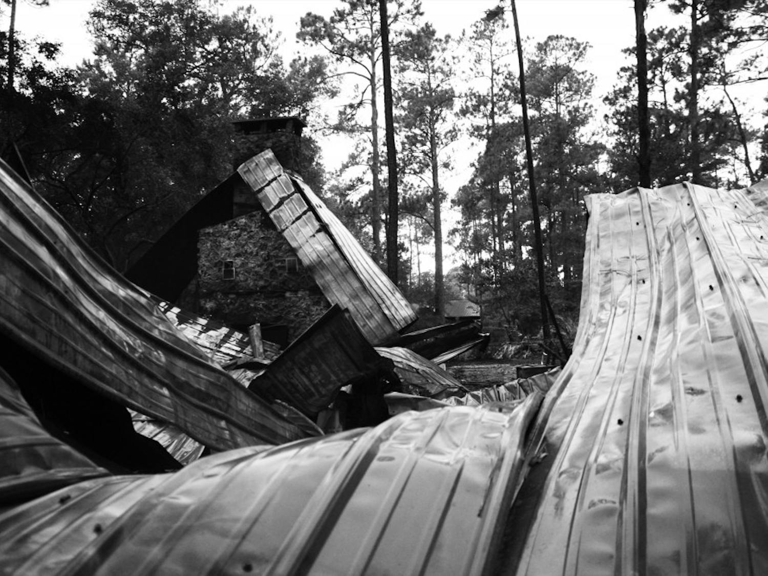 A fire burned down a cypress log conference center on Tuesday in
UF's Austin Cary Memorial Forest, 16025 Waldo Road.