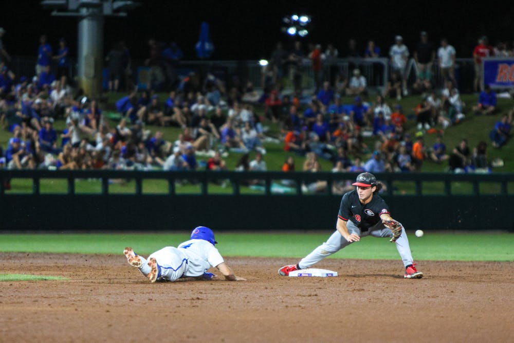 A Florida player slides into second base in the Gators' 13-11 loss to the Georgia Bulldogs on Friday, April 14, 2023.