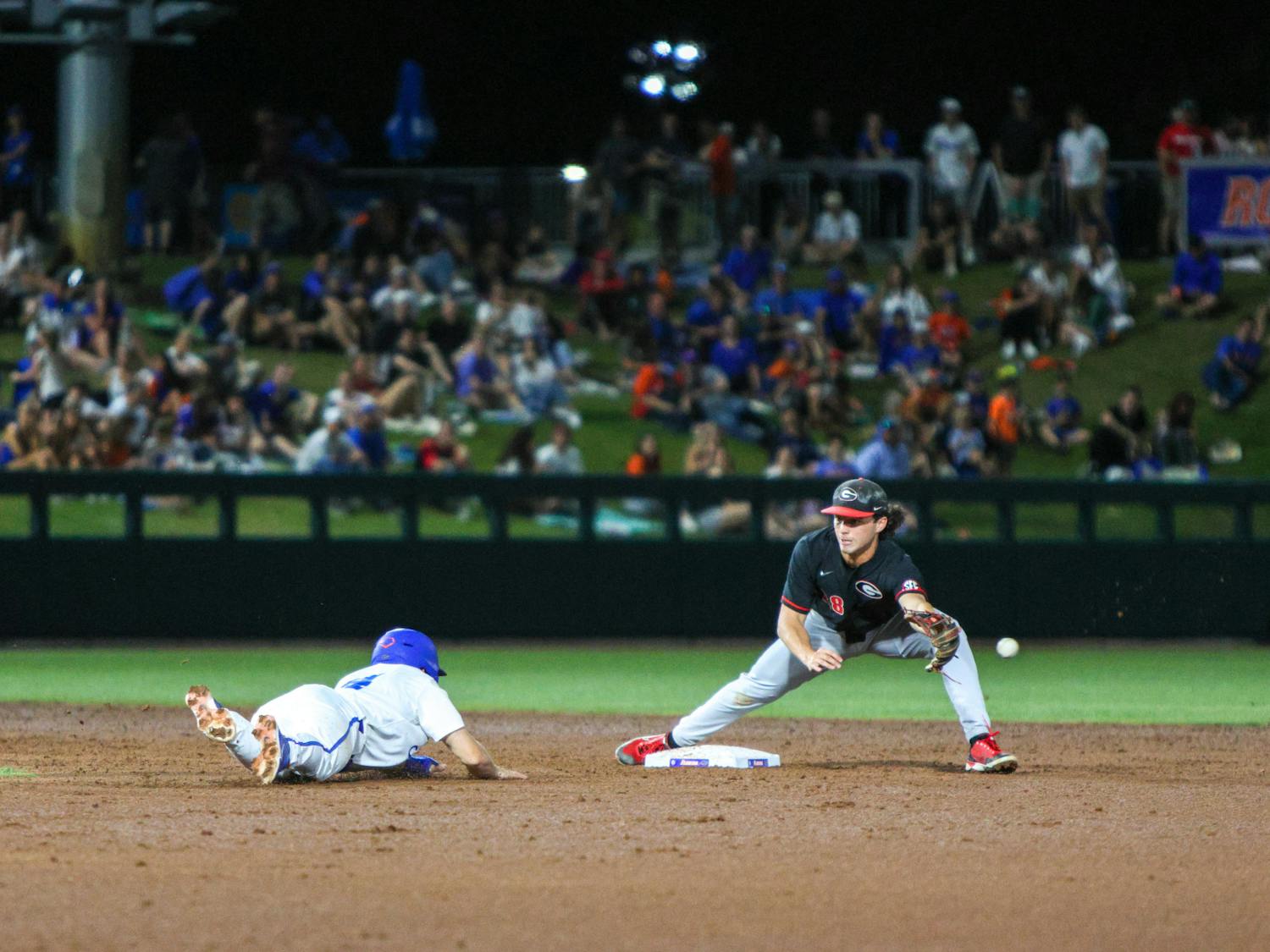 A Florida player slides into second base in the Gators' 13-11 loss to the Georgia Bulldogs on Friday, April 14, 2023.
