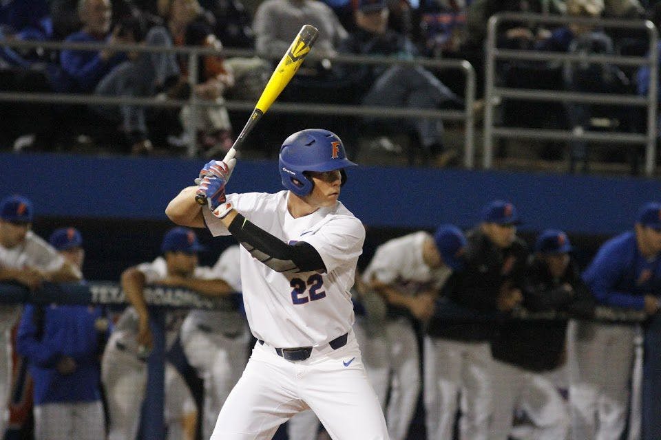 UF first baseman JJ Schwarz prepares to swing during Florida's 5-4 win against William &amp; Mary on Feb. 17, 2017, at McKethan Stadium.