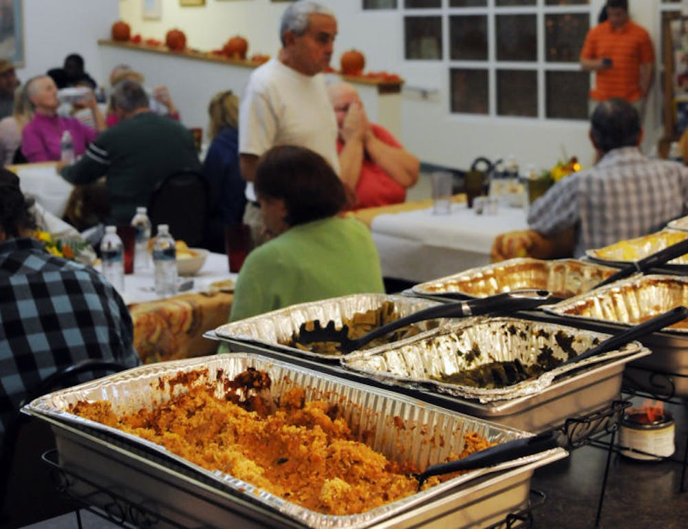 <p>Guests dine at a Thanksgiving-style feast Thursday evening at Gainesville’s American Cancer Society Winn-Dixie Hope Lodge. Winn-Dixie hosted the dinner.</p>