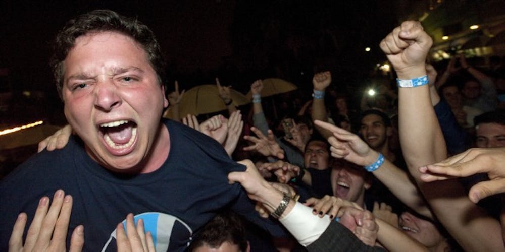 <p>Tj Villamil celebrates winning the Student Government presidency early Thursday morning outside the Reitz Union.</p>