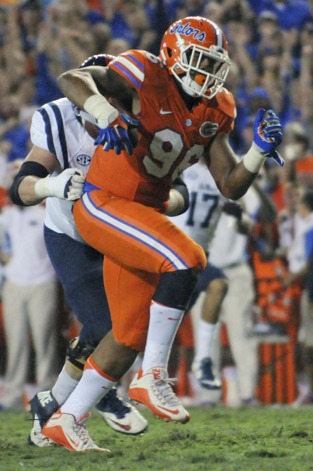 <p>UF defensive lineman CeCe Jefferson returns a fumble during the fourth quarter of Florida's 38-10 win against Ole Miss on Oct. 3, 2015, at Ben Hill Griffin Stadium.</p>