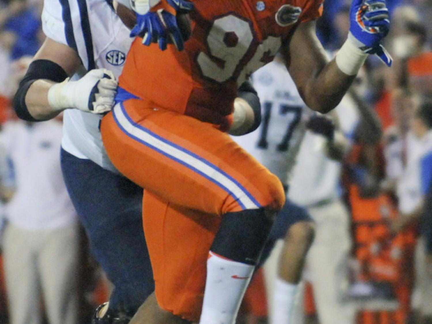 UF defensive lineman CeCe Jefferson returns a fumble during the fourth quarter of Florida's 38-10 win against Ole Miss on Oct. 3, 2015, at Ben Hill Griffin Stadium.