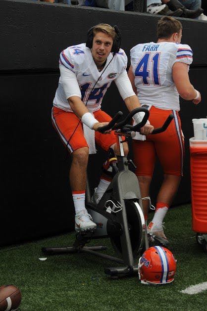 UF quarterback Luke Del Rio rides the bike during Florida's 13-6 win against Vanderbilt on Oct. 1, 2016, at Vanderbilt Stadium in Nashville, Tennessee.