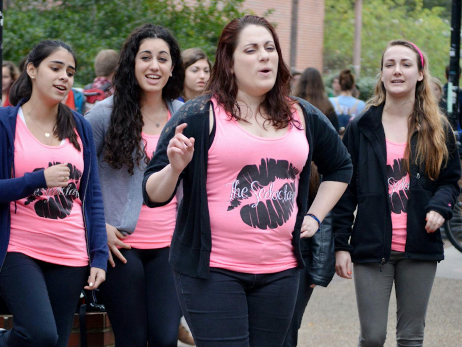 Kelsey Roessler, a 21-year-old UF accounting junior, performs Wednesday on Turlington Plaza with a capella group the Sedoctaves. 