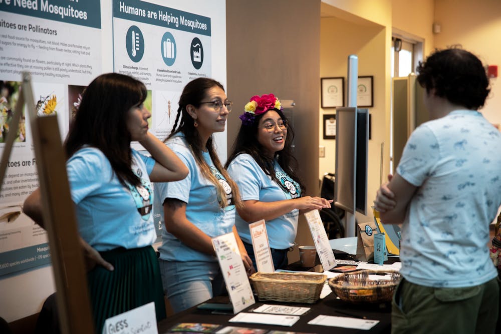 <p>The Society for the Advancement of Chicanos/Hispanics and Native Americans in Science tables and talks to visitors at the Florida Museum of Natural History Sunday, Oct. 2, 2022.</p>