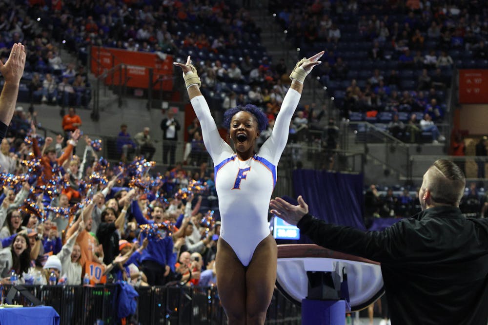 Florida gymnast Trinity Thomas celebrates after a perfect landing from her vault routine against the Georgia Bulldogs Friday, Jan. 27, 2023.
