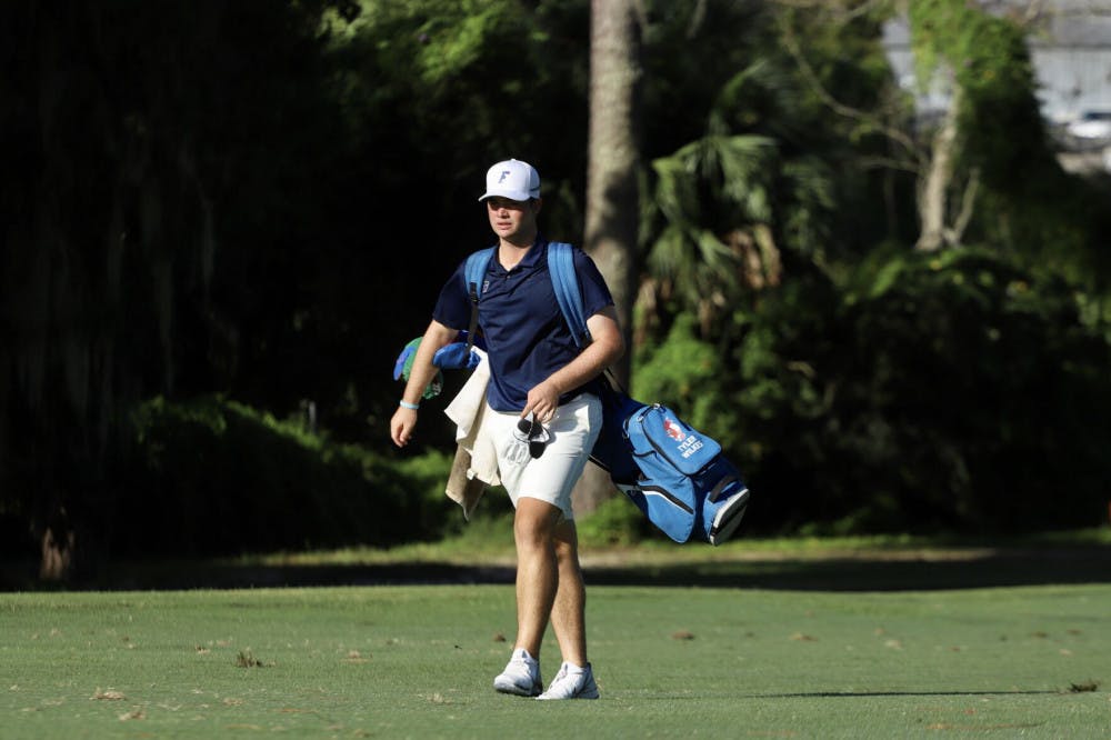 Florida golfer Tyler Wilkes walks down a fairway at Mark Bostick Golf Club. The Florida men's golf team released its 2021-22 schedule Friday.