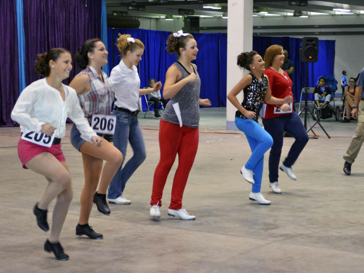A group of clog dancers performs at Gainesville’s first clogging festival, which was on the Alachua County Fairgrounds on Saturday. Eight teams competed in the Florida Clogging Festival and will advance to two national competitions.