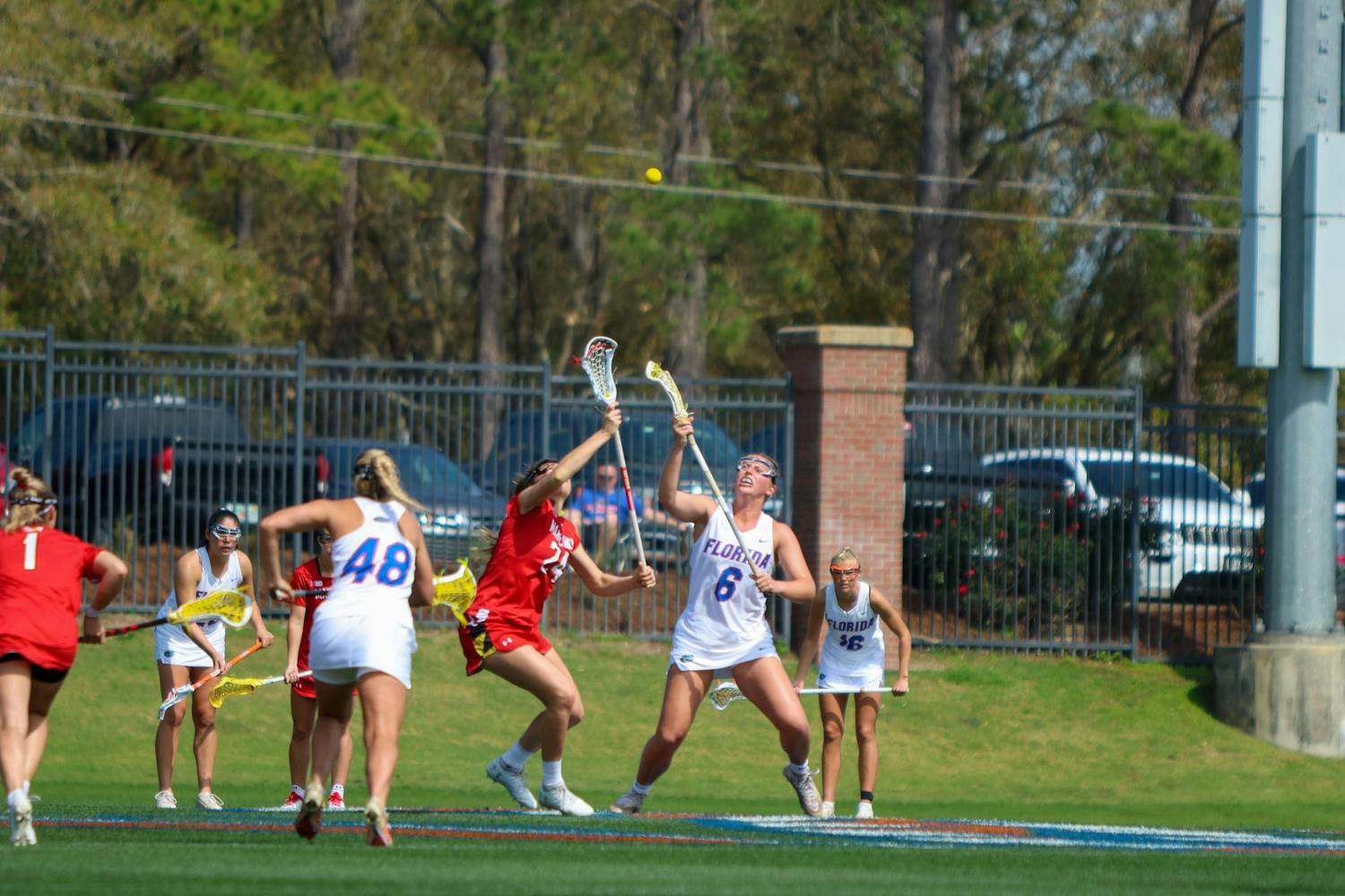 Florida attacker Liz Harrison fights for a draw control during the Gators' 14-13 loss to the Terrapins on Saturday, Feb. 25, 2023.