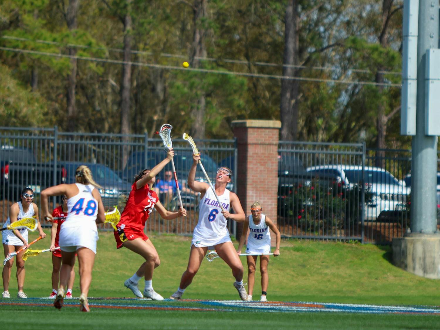 Florida attacker Liz Harrison fights for a draw control during the Gators' 14-13 loss to the Terrapins on Saturday, Feb. 25, 2023.