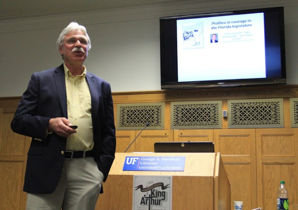 <p>Former UF professor Stephen Mulkey speaks about climate change in the Smathers Library East on Tuesday night.</p>