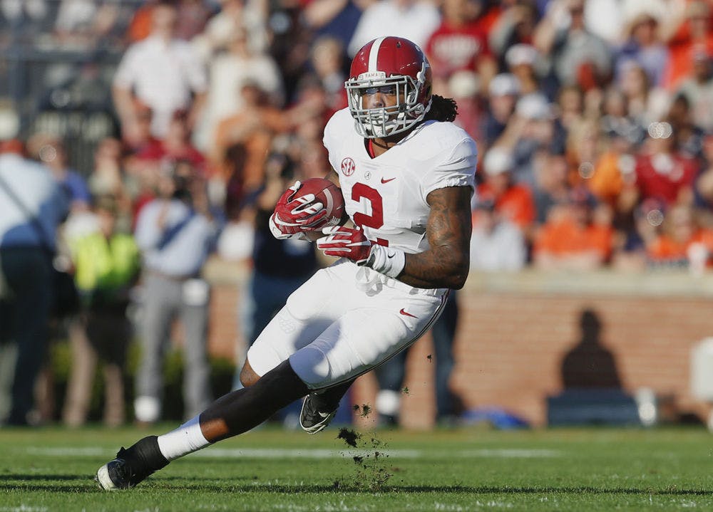 Alabama running back Derrick Henry (2) runs the ball during an NCAA college football game against Auburn, Saturday, Nov. 28, 2015, in Auburn, Ala. Alabama won 29-13.