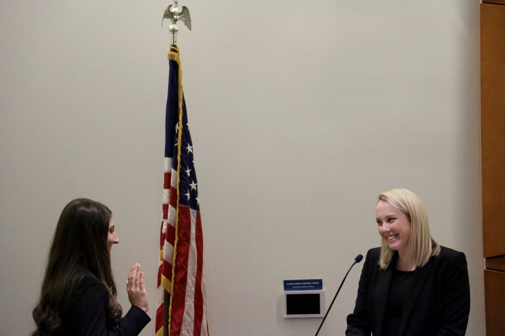 New UF Student Senate President Danielle Grosse stands before the senators as she is sworn in on Tuesday evening in the Reitz Union Chamber Room. "There will always be more that we can accomplish as student senators, and I am excited to get to work with you all to achieve these things," Grosse said. 