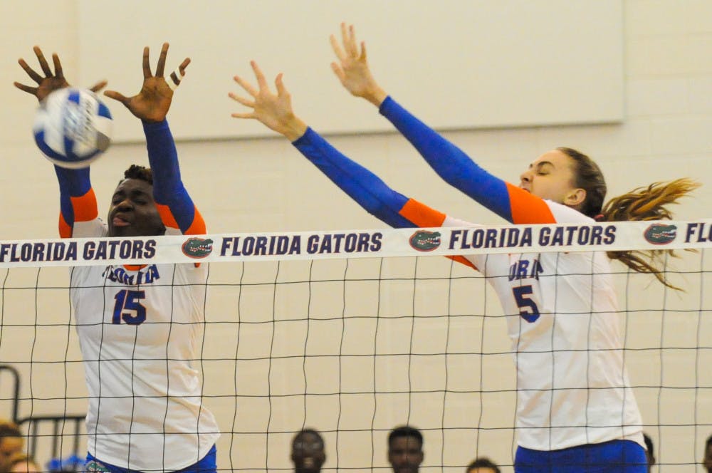 <p>Rachael Kramer (right) attempts a block during Florida's 3-0 win over Jacksonville on Sept. 16, 2016, in the Lemerand Center.</p>