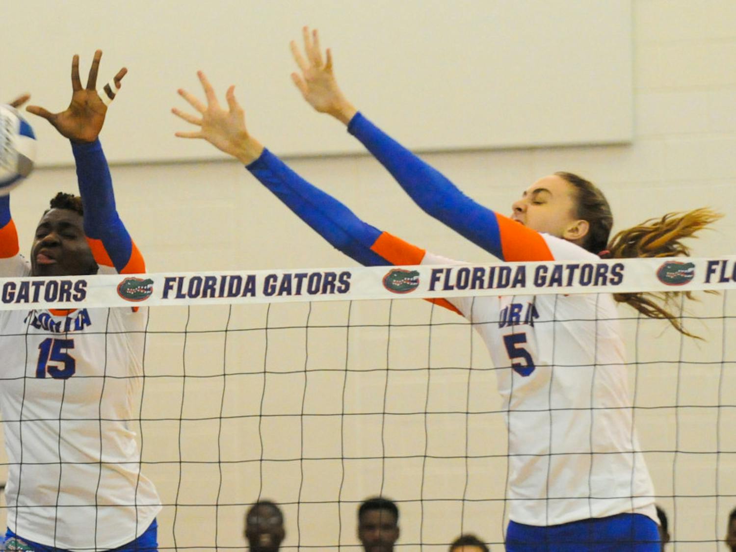 Rachael Kramer (right) attempts a block during Florida's 3-0 win over Jacksonville on Sept. 16, 2016, in the Lemerand Center.