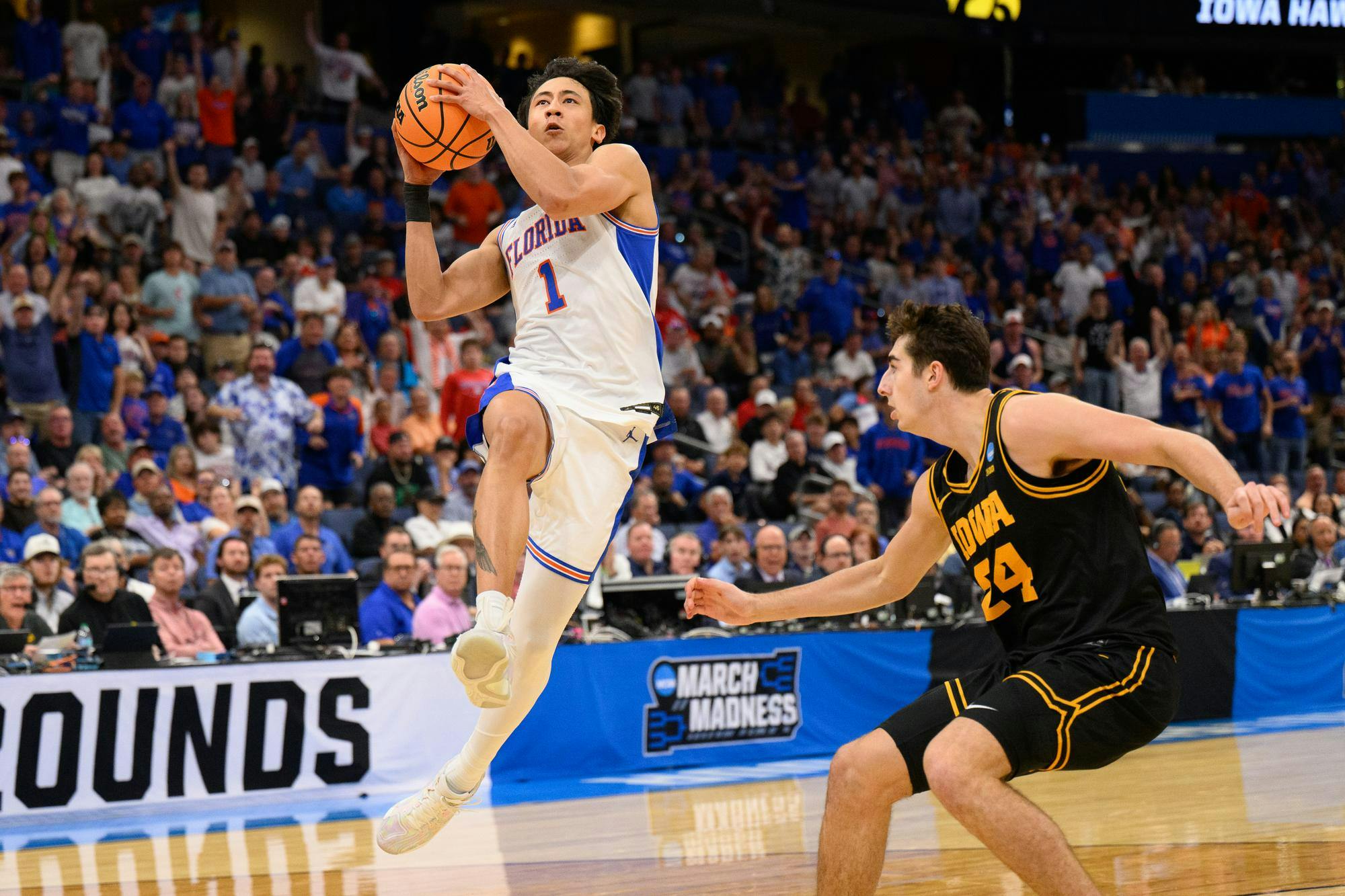 Florida guard Xaivian Lee (1) shoots a layup during the first half of an NCAA Tournament second round game against Iowa, Sunday, March 22, 2026, in Tampa, Fla.