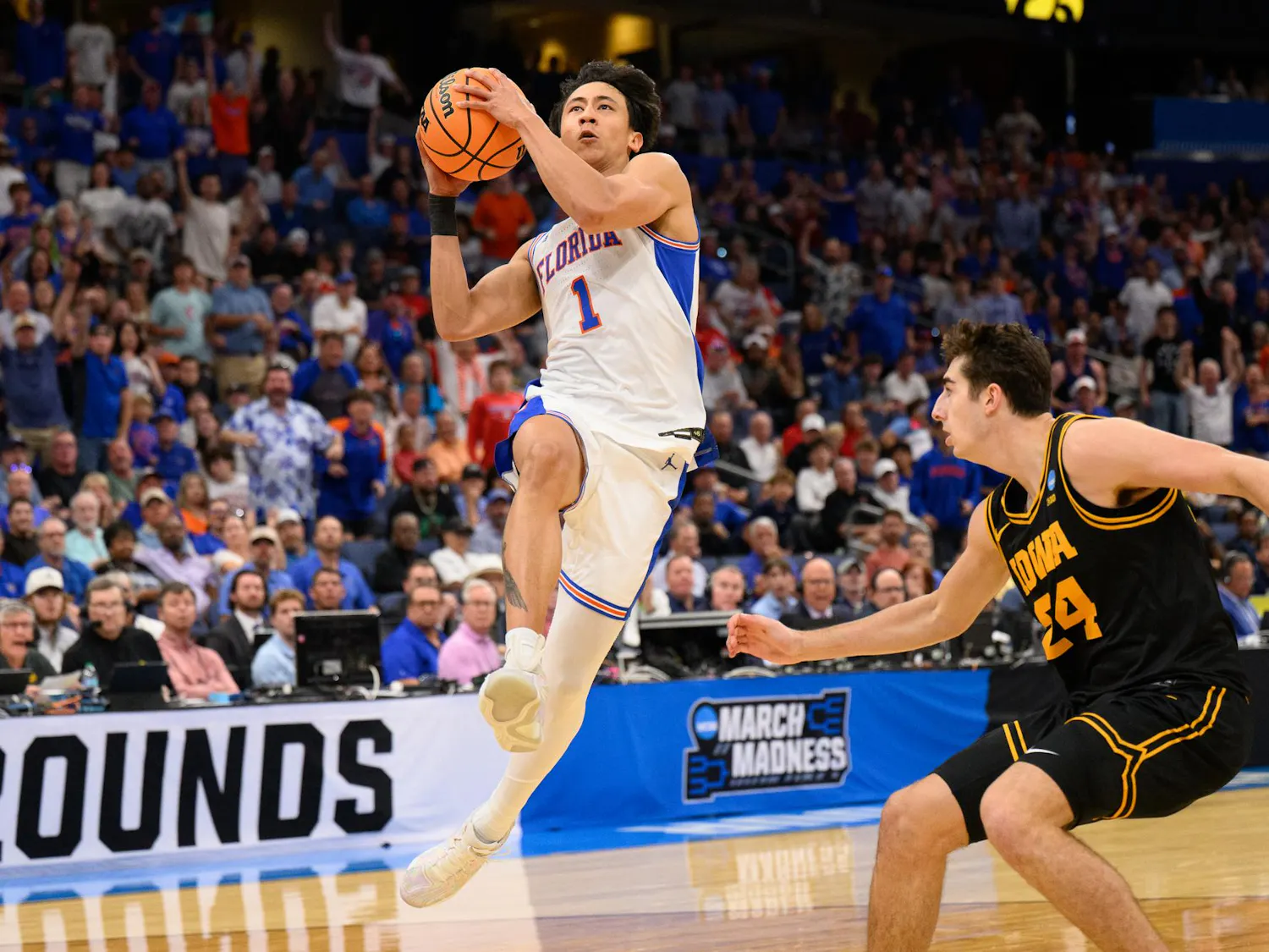 Florida guard Xaivian Lee (1) shoots a layup during the first half of an NCAA Tournament second round game against Iowa, Sunday, March 22, 2026, in Tampa, Fla.