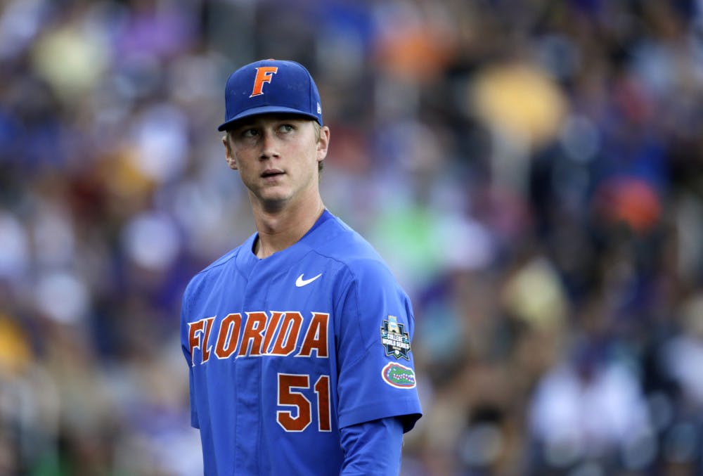 <p>UF starting pitcher Brady Singer pitched 5.0 innings and gave up four runs on seven hits in Florida's elimination game loss to Arkansas on Friday.&nbsp;&nbsp;</p>