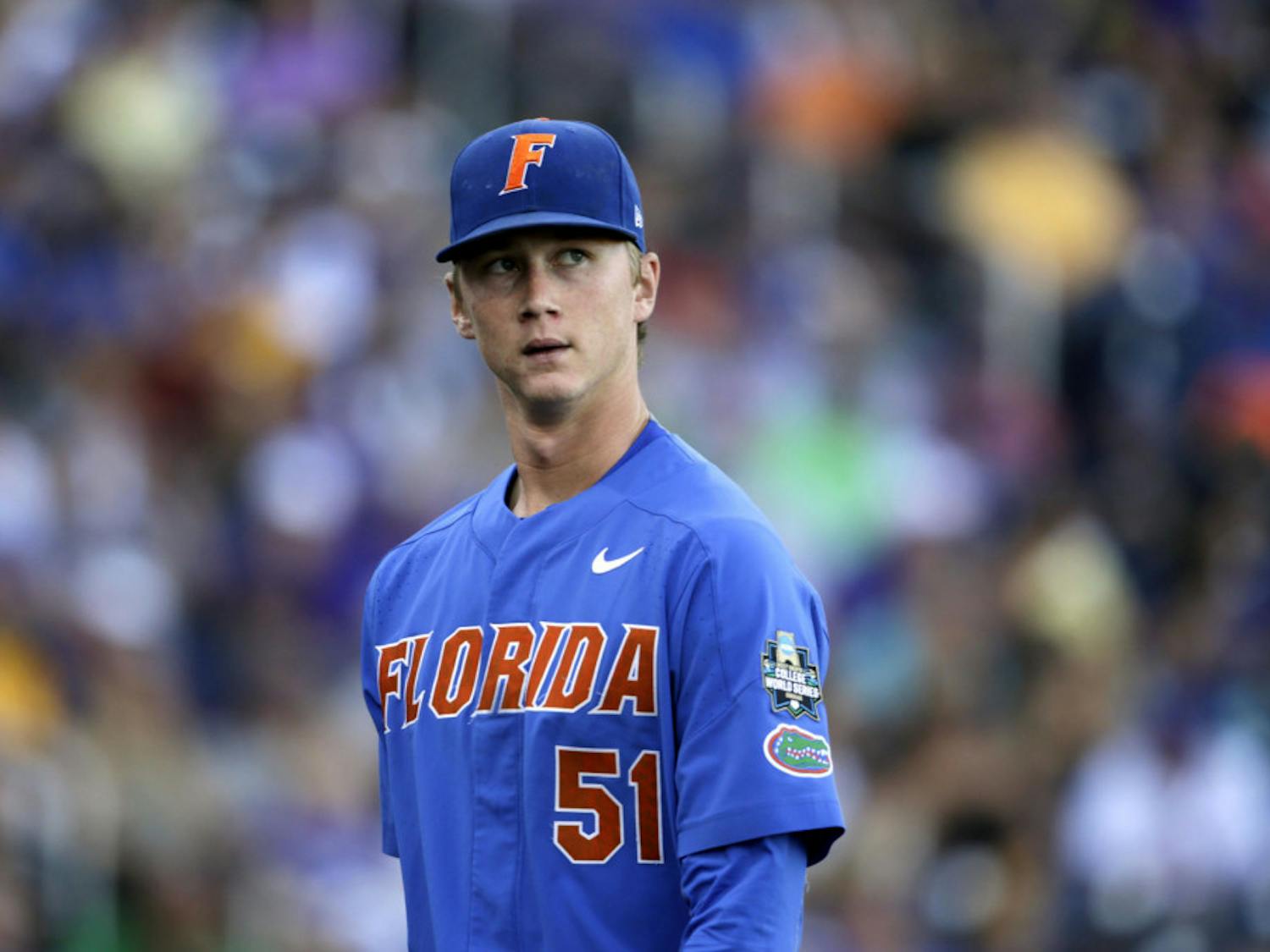 UF starting pitcher Brady Singer pitched 5.0 innings and gave up four runs on seven hits in Florida's elimination game loss to Arkansas on Friday. 