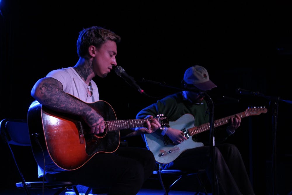 <p dir="ltr">Musicians Noah Gundersen (left) and Harrison Whitford (right) collaborate during an acoustic performance on Sunday.</p>