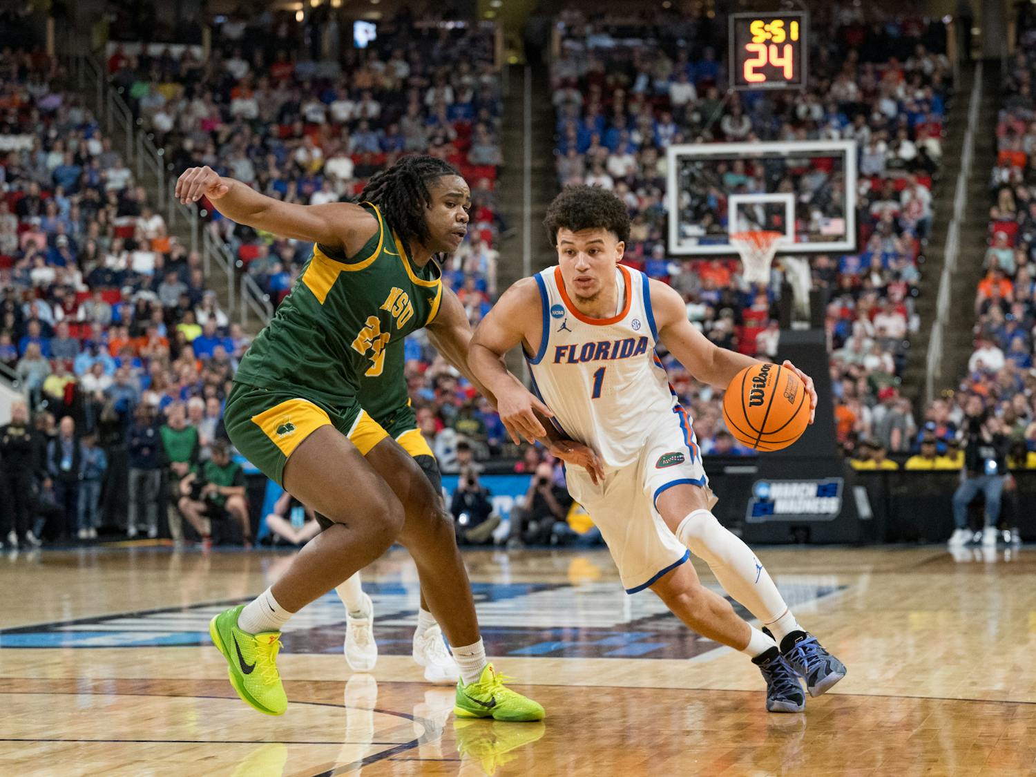 Florida Gators guard Walter Clayton Jr. (1) drives with the ball during a basketball game against Norfolk State in the first round of the NCAA Tournament on Friday, March 21, 2025, in Raleigh, N.C.