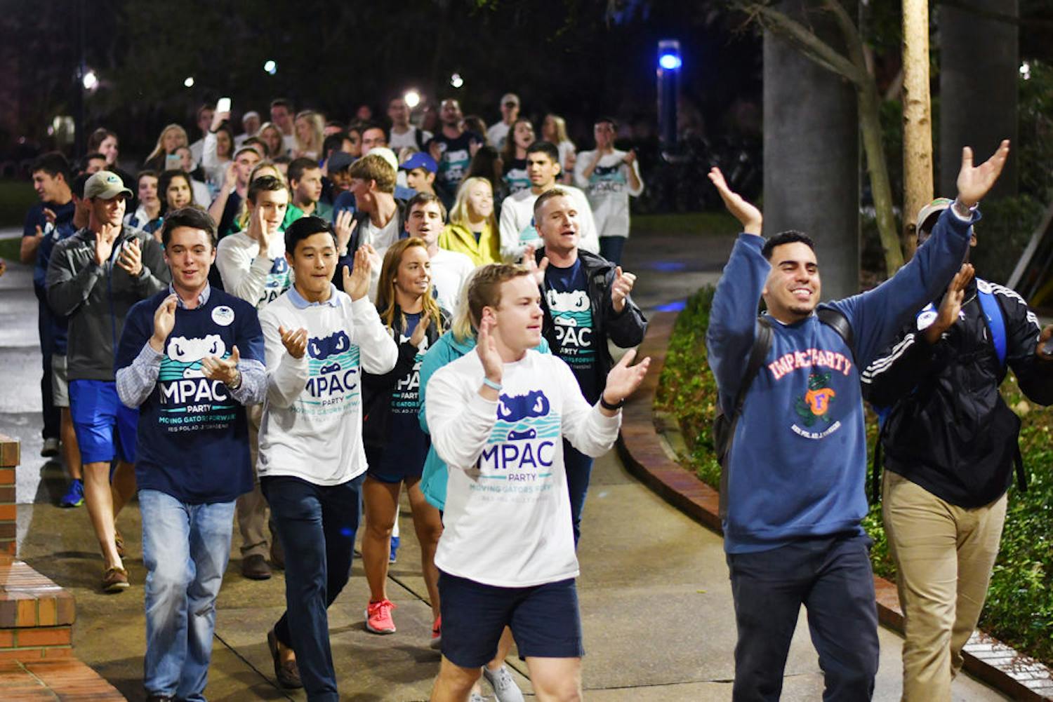 The Impact Party walks to the Reitz Union Breezeway on Feb. 22, 2017, chanting “I-M-P-A-C-T. Impact is for you and me.” The Impact Party won 48 seats in the Spring 2017 election.