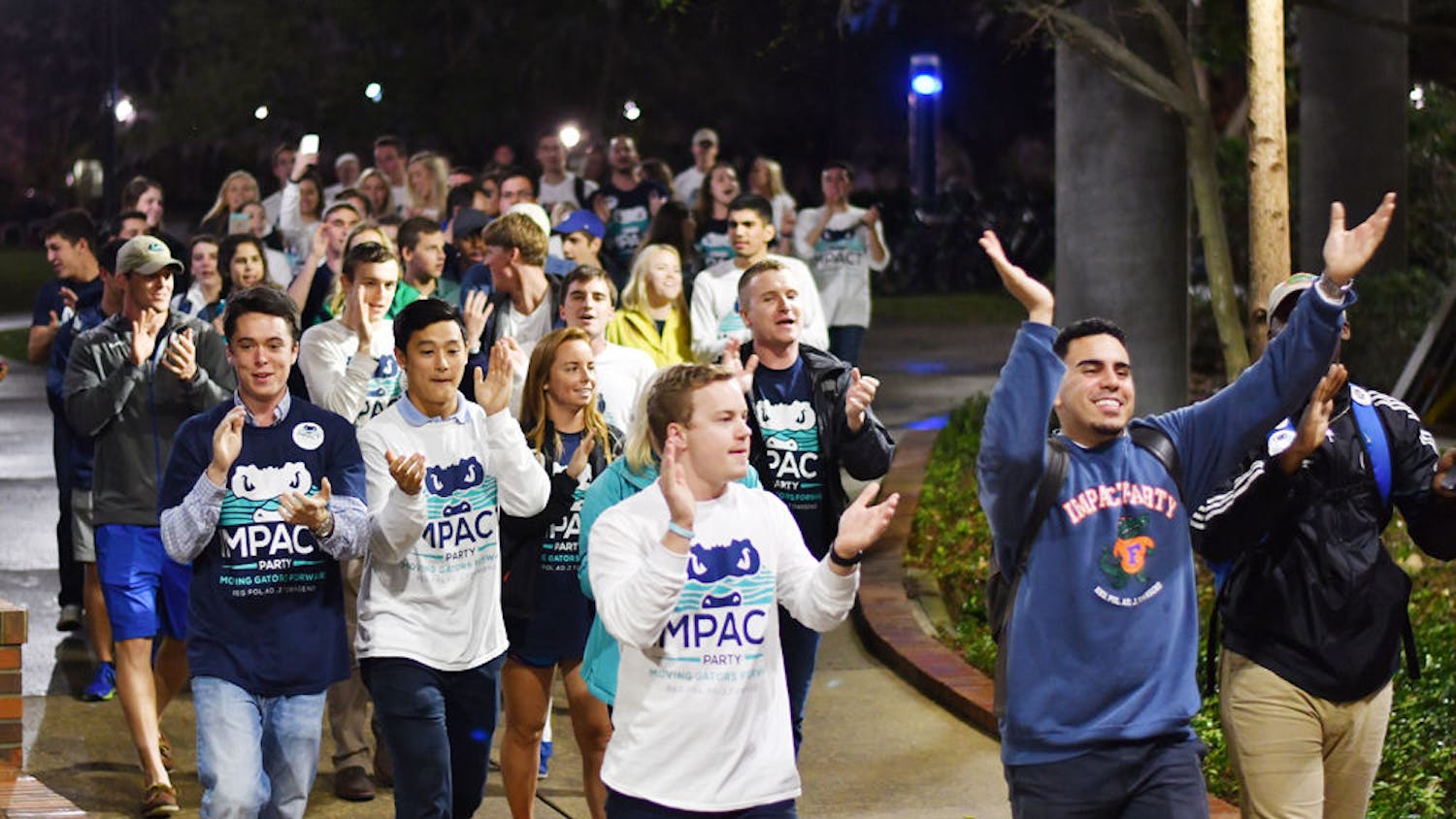 The Impact Party walks to the Reitz Union Breezeway on Feb. 22, 2017, chanting “I-M-P-A-C-T. Impact is for you and me.” The Impact Party won 48 seats in the Spring 2017 election.